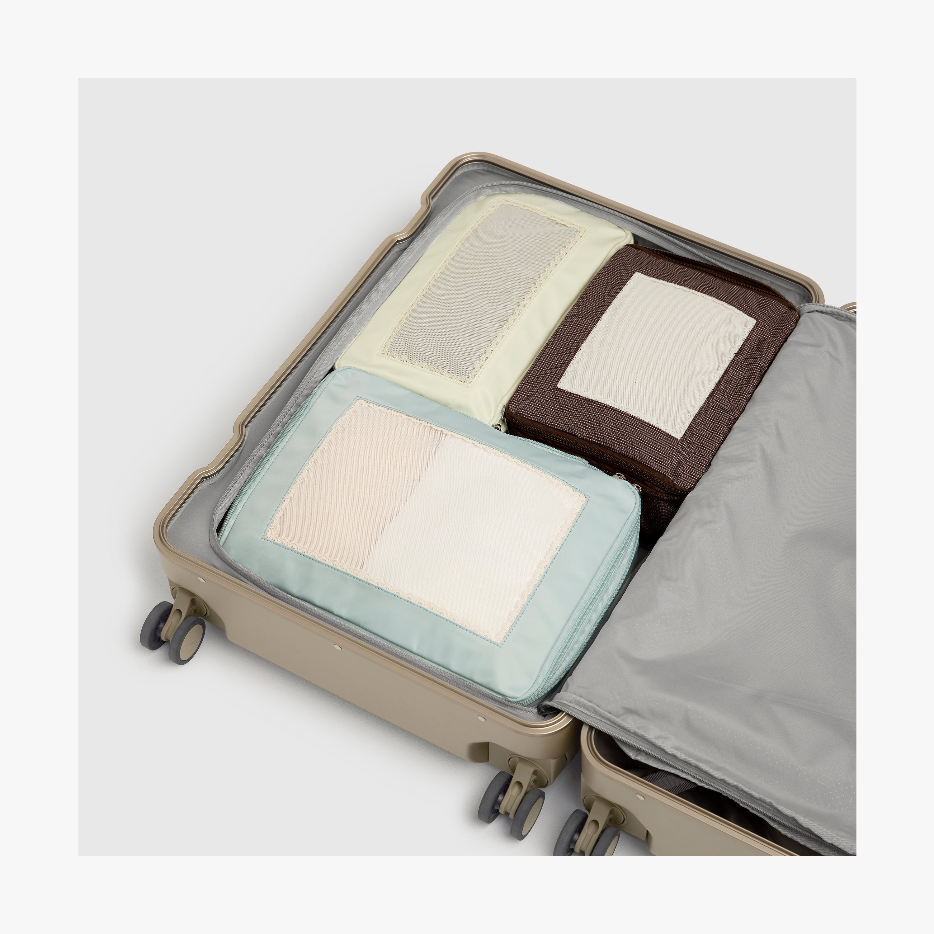 Monos × Reformation Compressible Packing Cubes